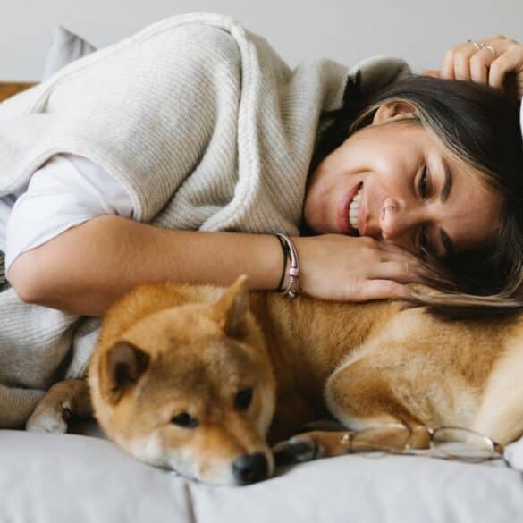 Woman greeting her dog